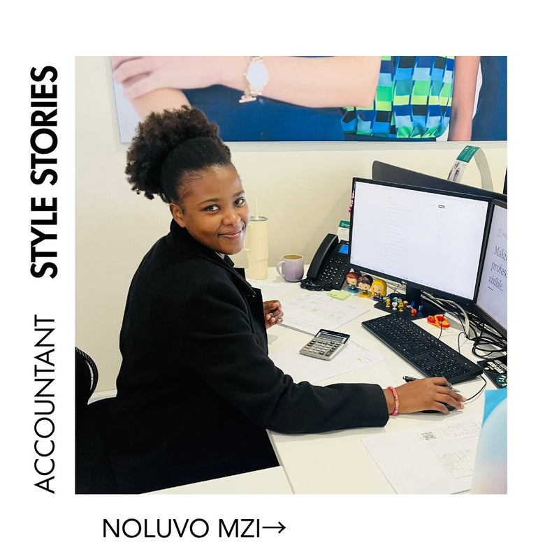 Nolu Mzi, accountant and finance professional, working at her desk in an office.