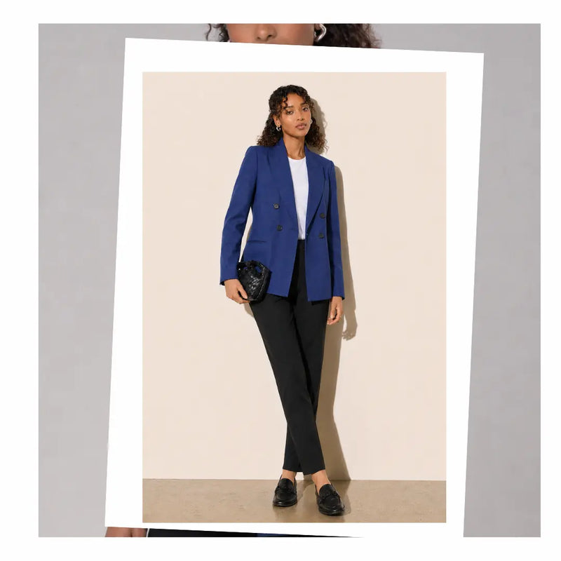 Women's office wear featuring a blue puppytooth blazer and black formal pants.