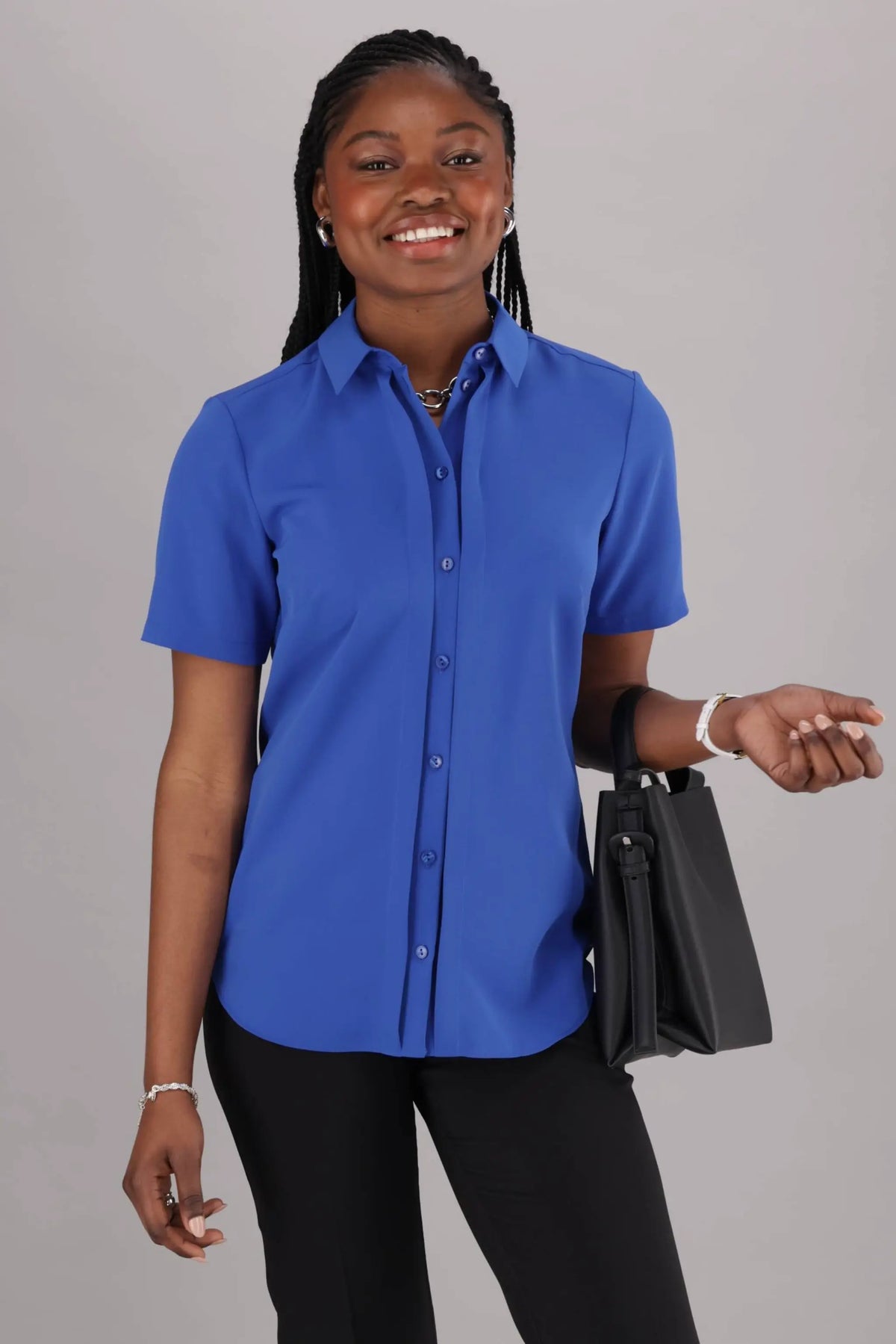 Women’s ImNow Short Sleeve work Shirt featuring a Collar, Button down Front and Pintuck Detail in Blue.