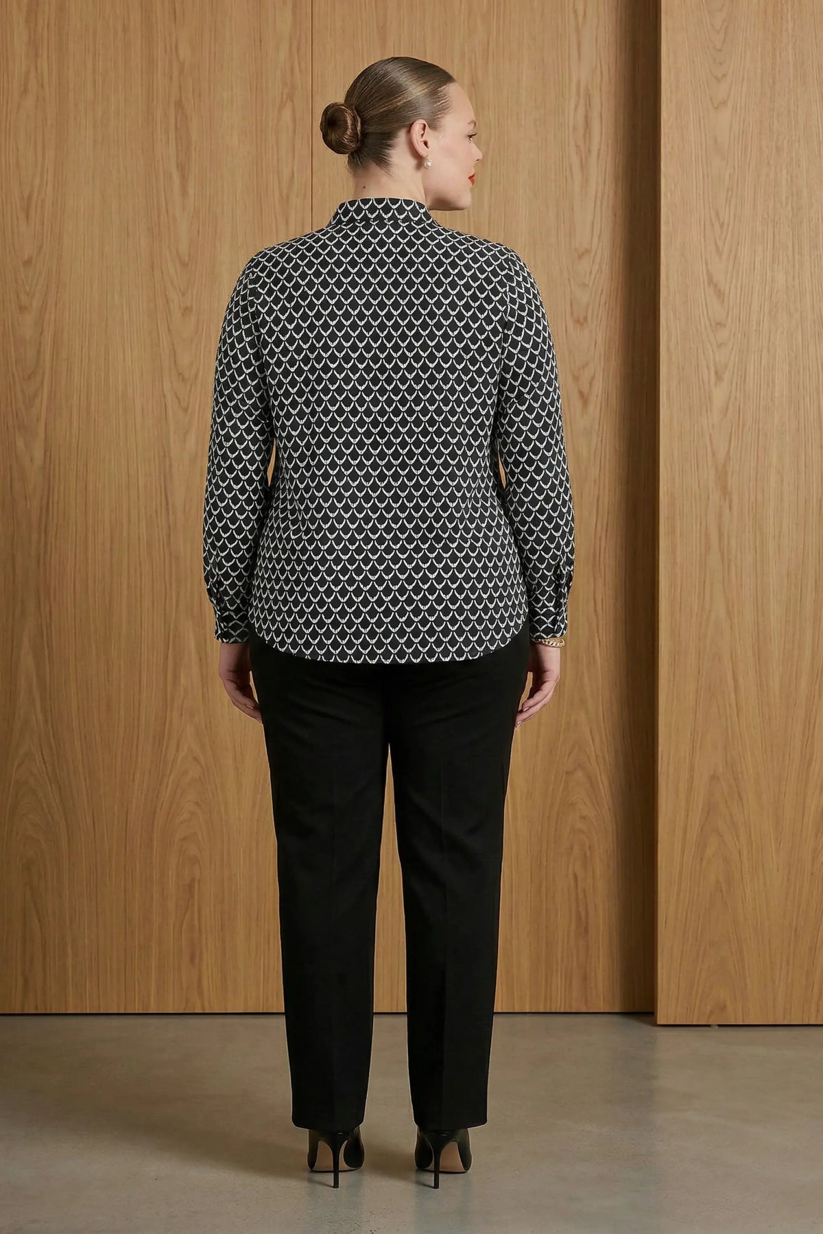 Ladies long sleeve blouse with a collar in black and white print by ImNow.