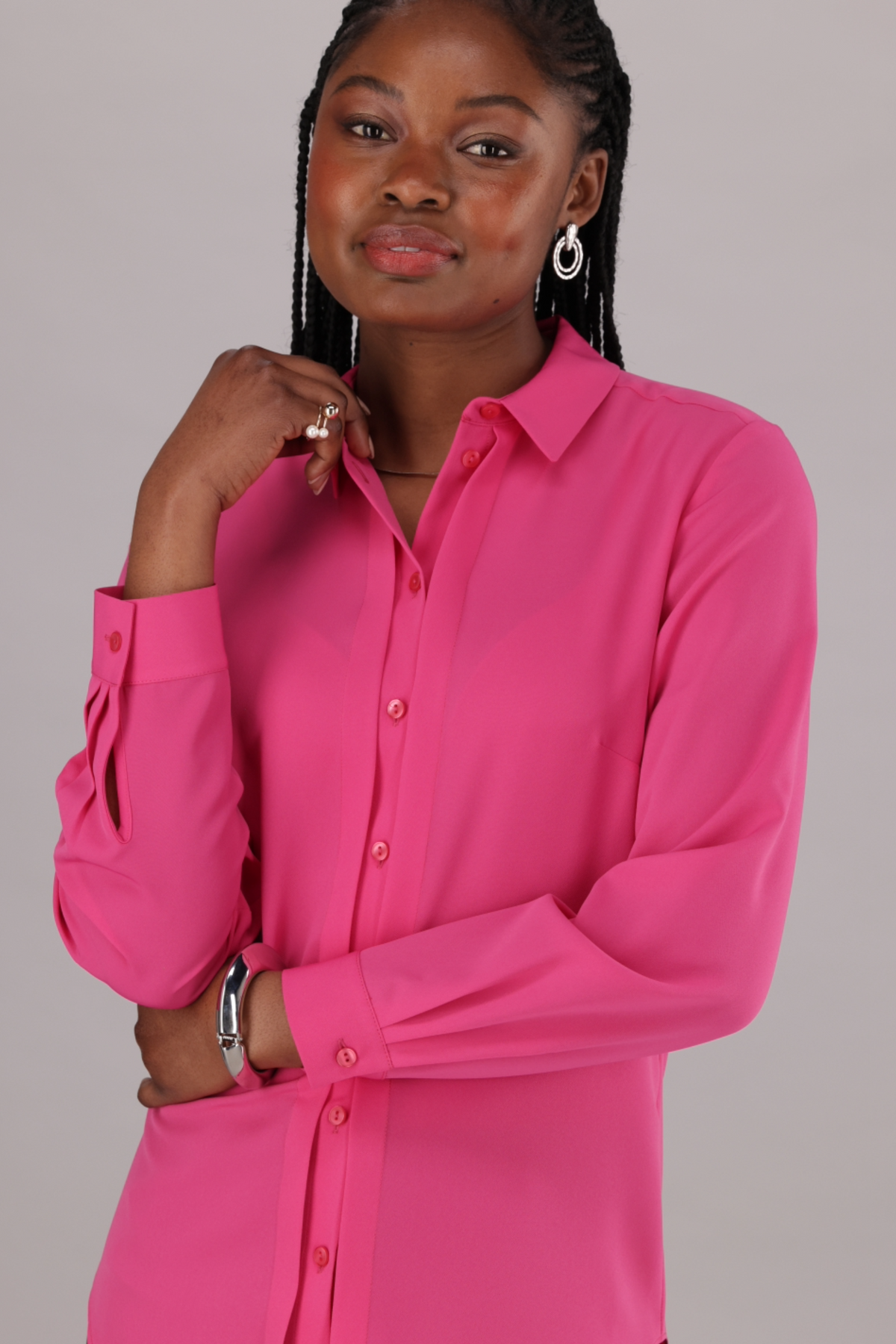 ImNow Women’s Classic Work Shirt with Pintuck Details along the Button Stand and tabbed Sleeves in Pink.