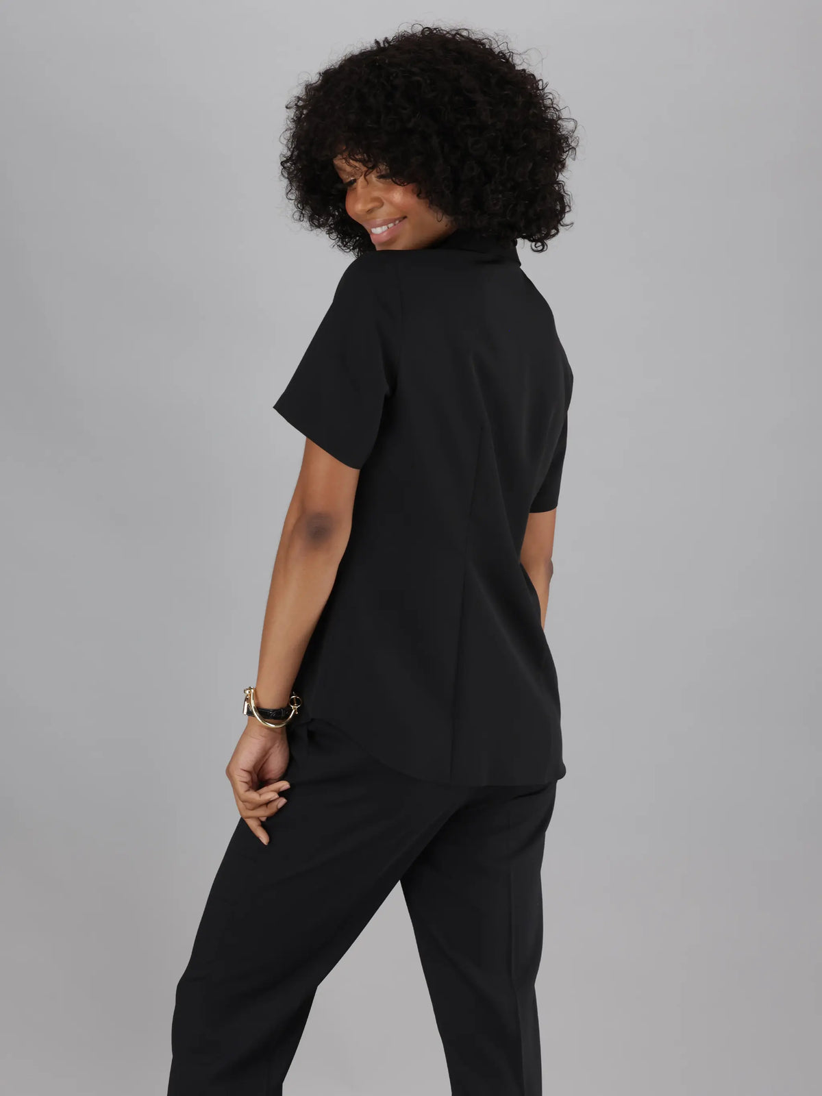 Classic ImNow Women’s Button Down Work Shirt with Pintuck Detailing. Available in Black.