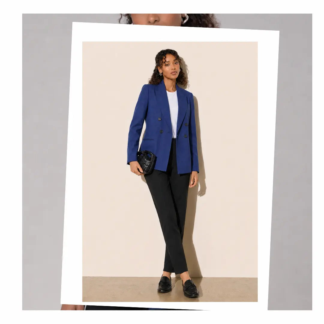 Women's office wear featuring a blue puppytooth blazer and black formal pants.