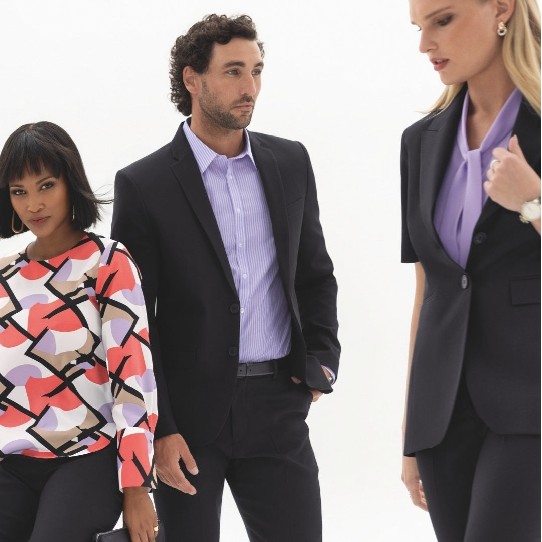 Office outfits in black suiting worn with a coral print top and lilac shirts, showing how a capsule work wardrobe mixes and matches