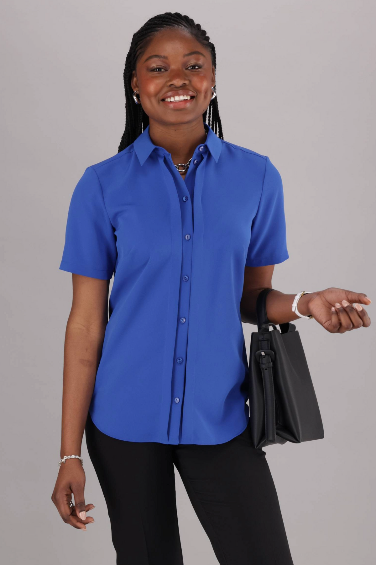 Women’s ImNow Short Sleeve work Shirt featuring a Collar, Button down Front and Pintuck Detail in Blue.