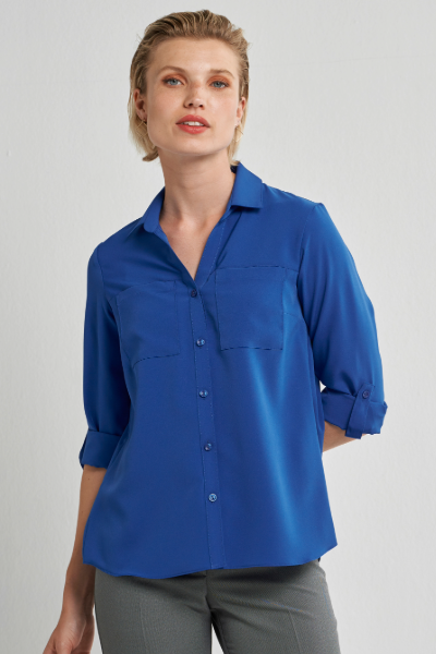 Women’s office shirt with front pockets paired with silver grey work pants