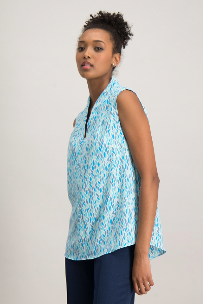 Smart sleeveless ladies’ blouse worn with trousers