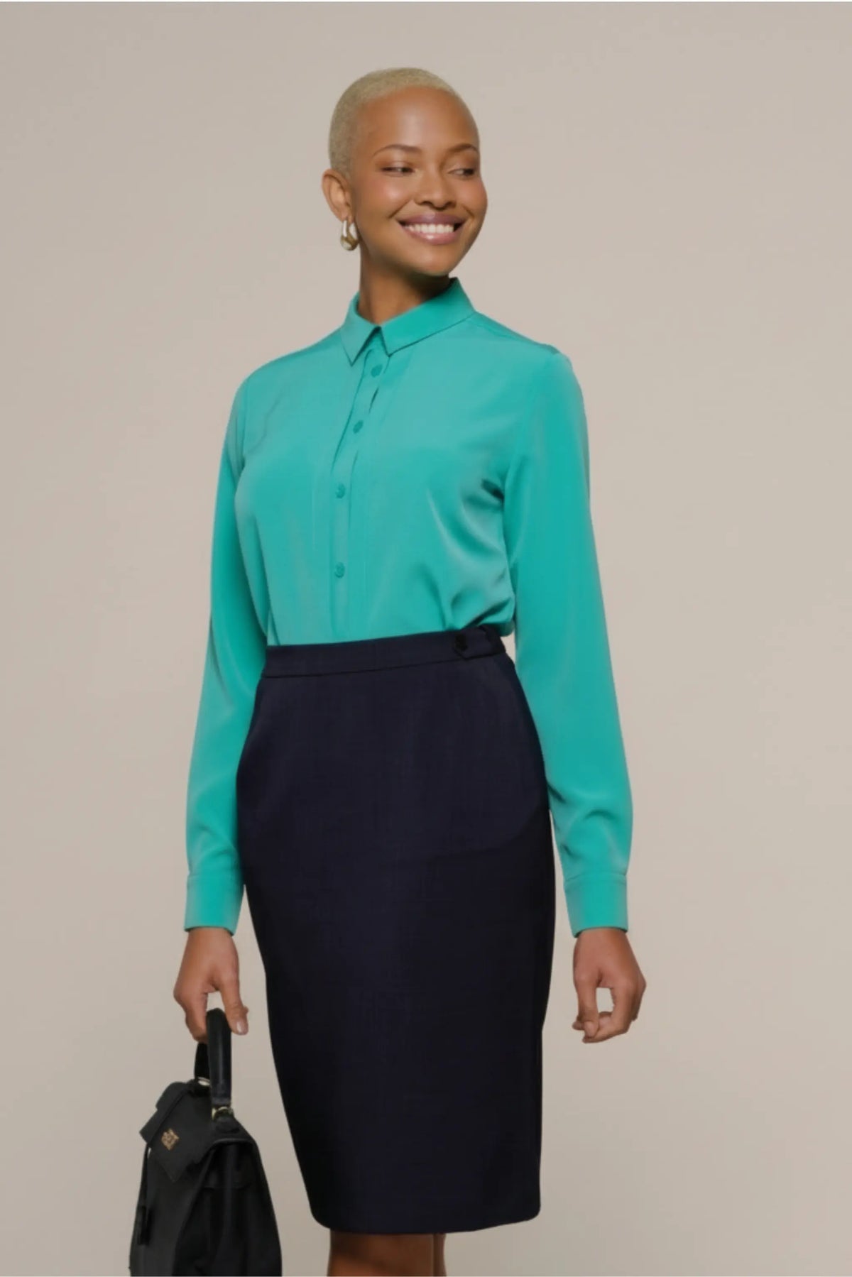 Ladies long sleeve blue shirt for work, with collar and buttoned down by ImNow.