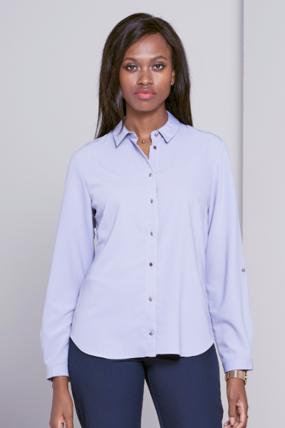 Women’s work blouse with buttons styled with formal black trousers