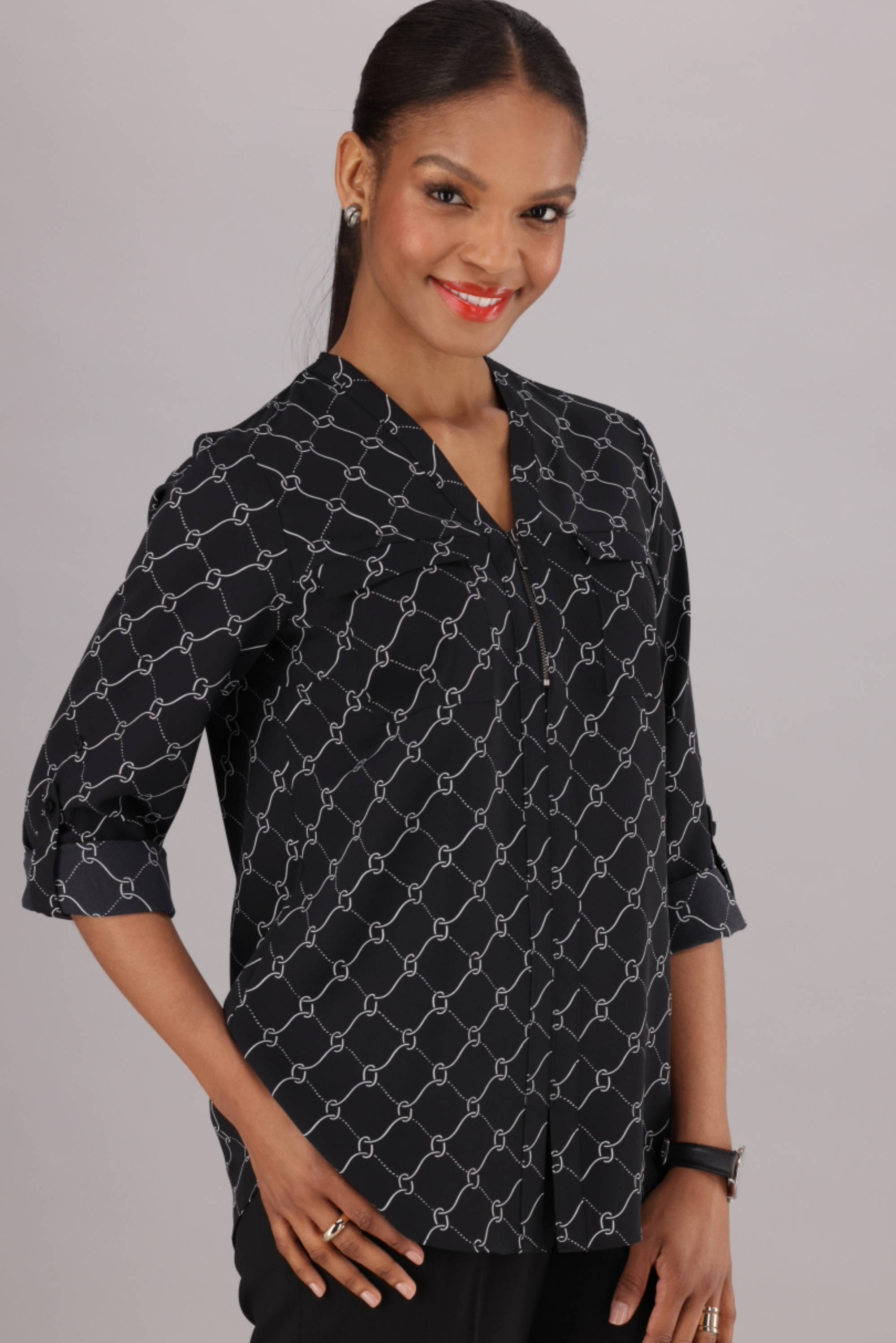 Black and White Printed Long Sleeve blouses with a Tab on the sleeve and V-Neckline with zip front sold by ImNow. 