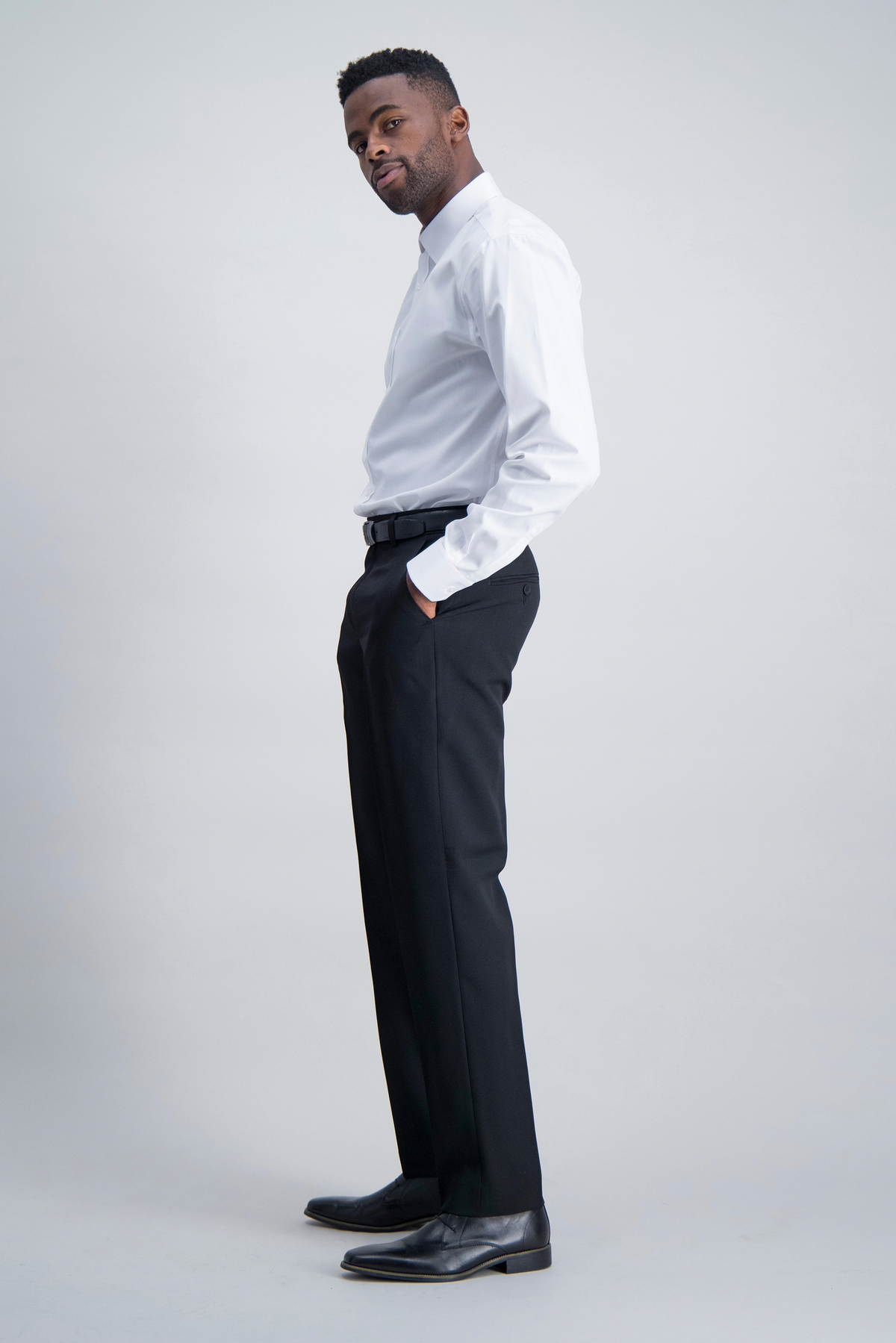 Side view of ImNow's mens tailored pants in black.