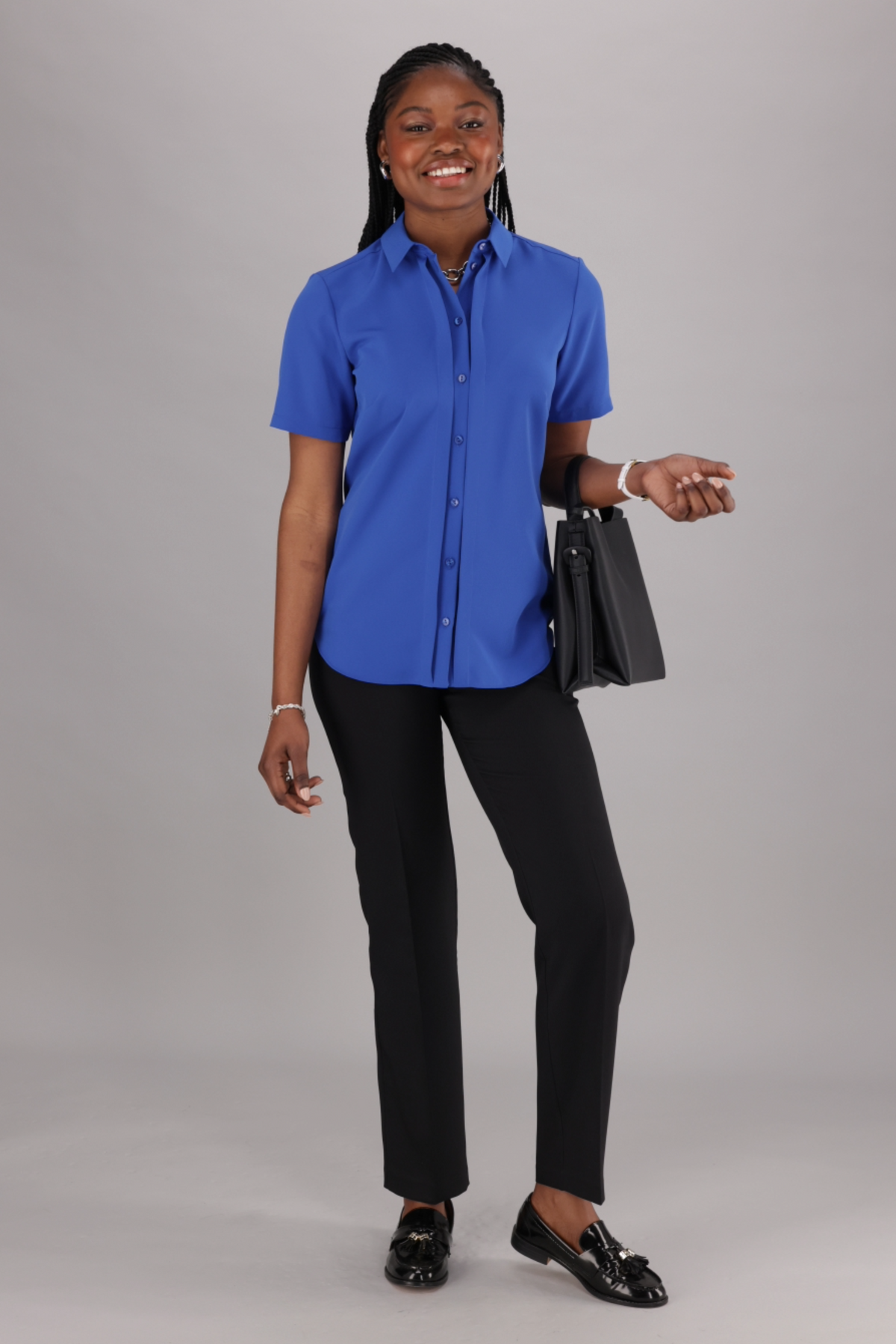 ImNow Women’s Short Sleeve Shirt with Structured Collar and Pintuck Front Design in Blue.