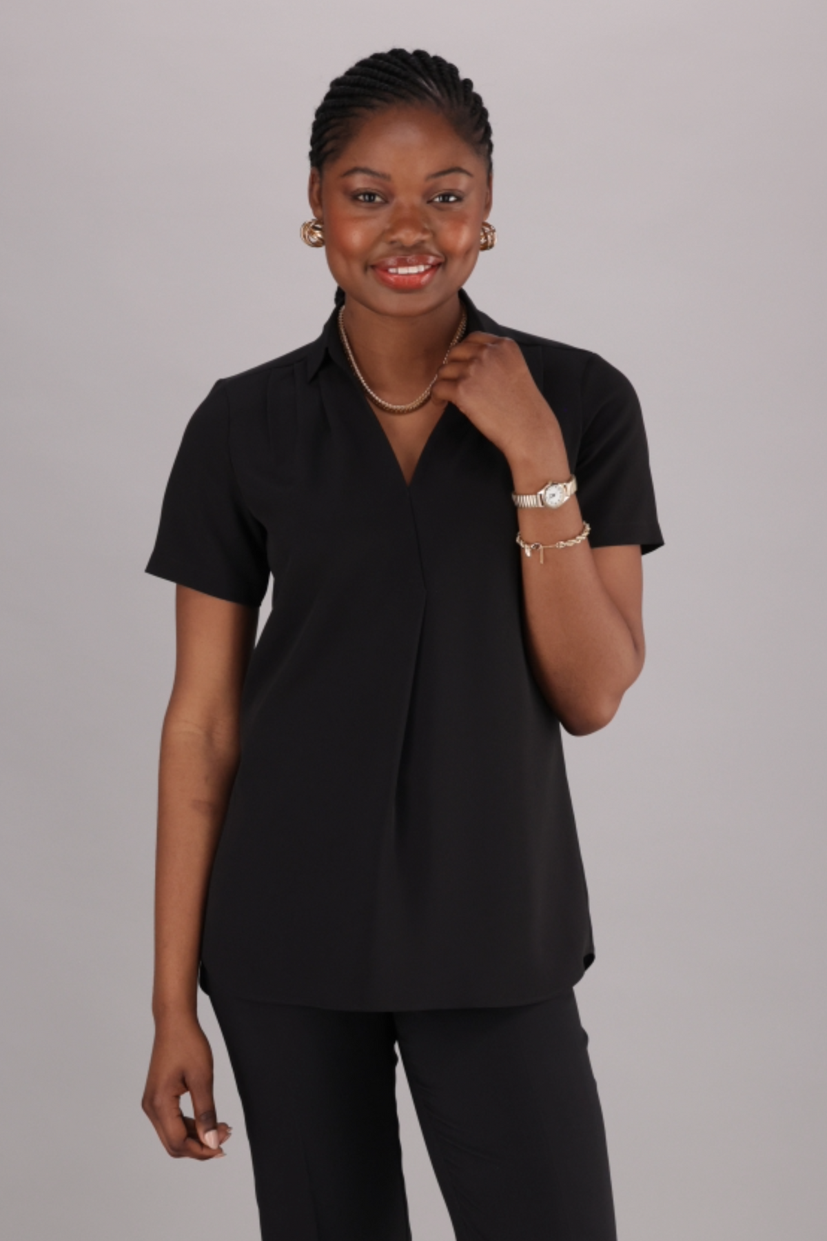 Women’s Black relaxed fit Short-Sleeve Work blouse with a V-Neckline and classic collar by ImNow. 
