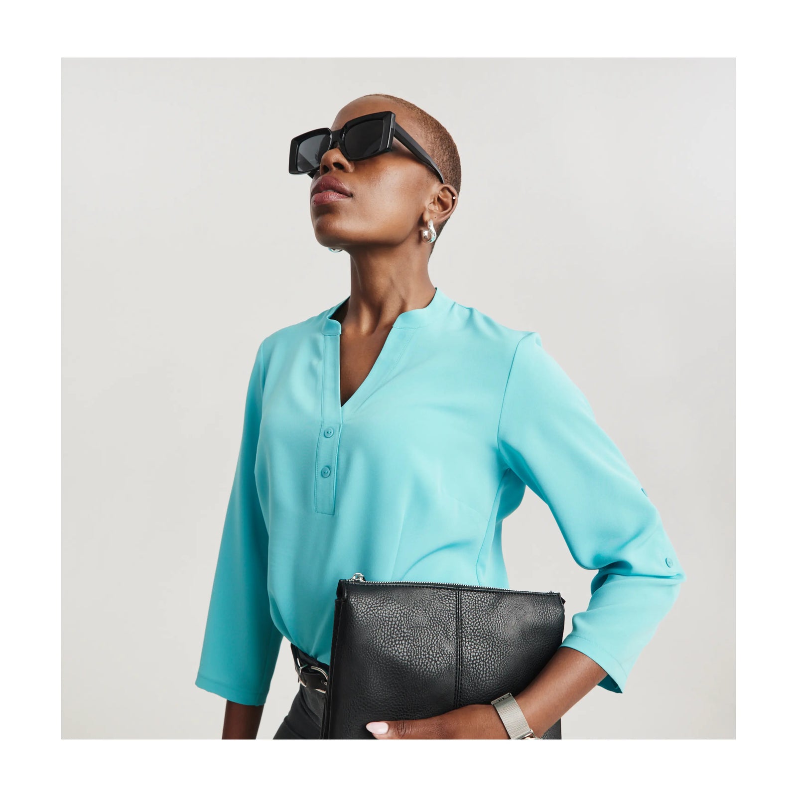 Women wearing a light blue top by ImNow South Africa.