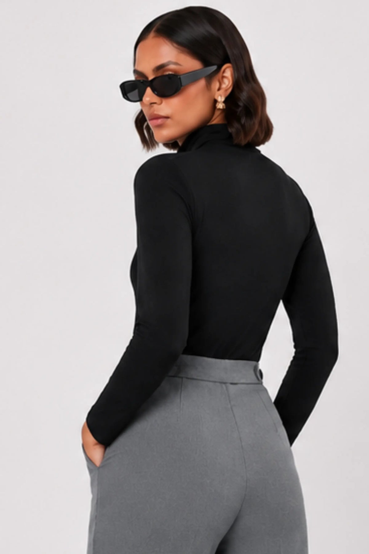 Women’s black stretch knit polo neck top with long sleeves and regular fit.