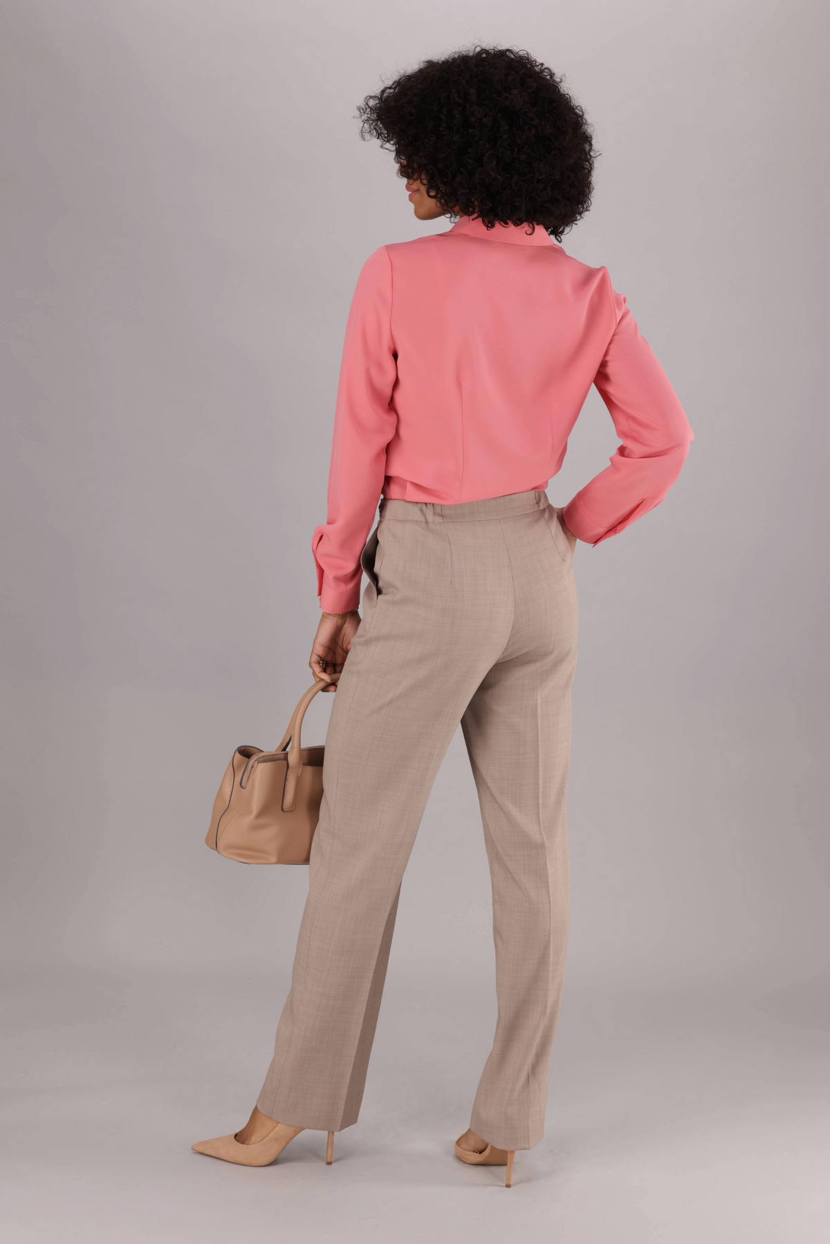 Back VIew of ImNow Women’s Formal Coral Blouse featuring structured Collar and Back Darts with Long Tabbed Sleeves.