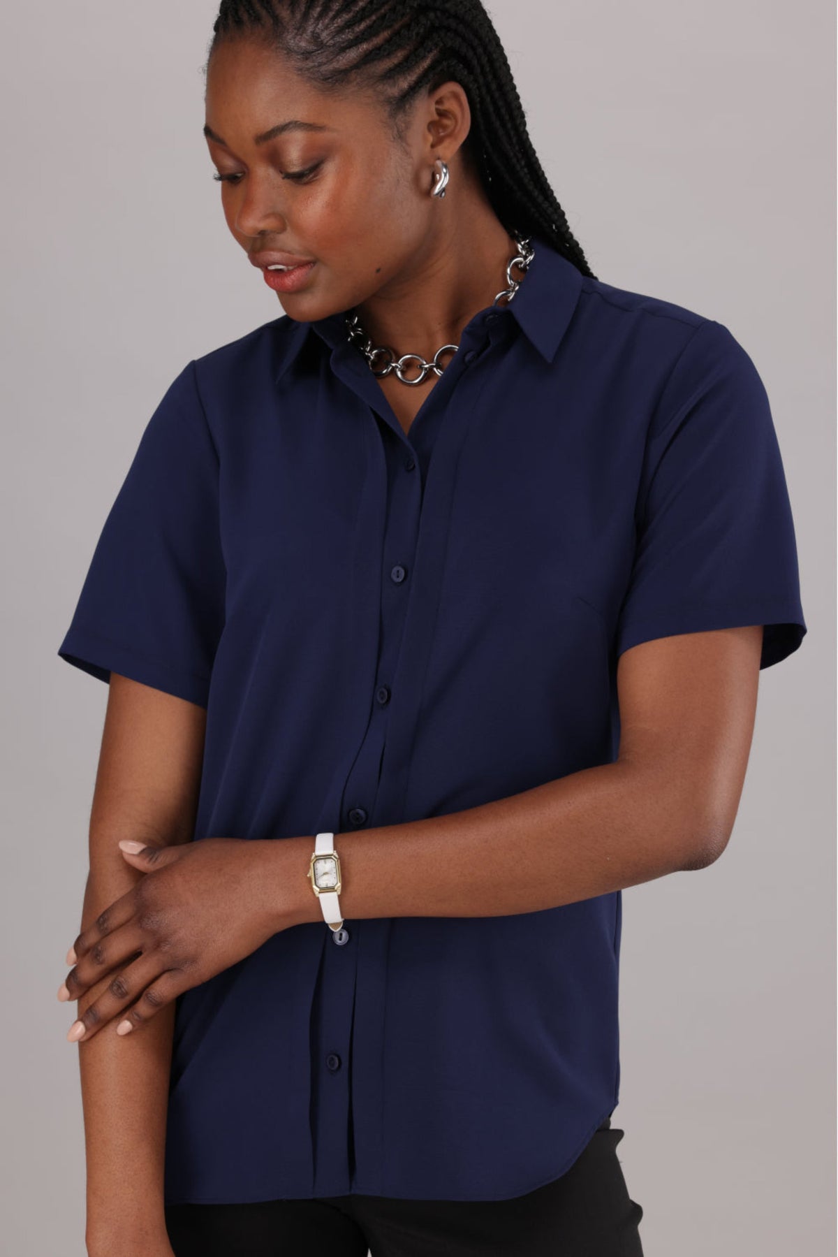 Navy Women’s Shirt Ideal for the Office from ImNow. It has Short Sleeves, Buttons and a Collar. 