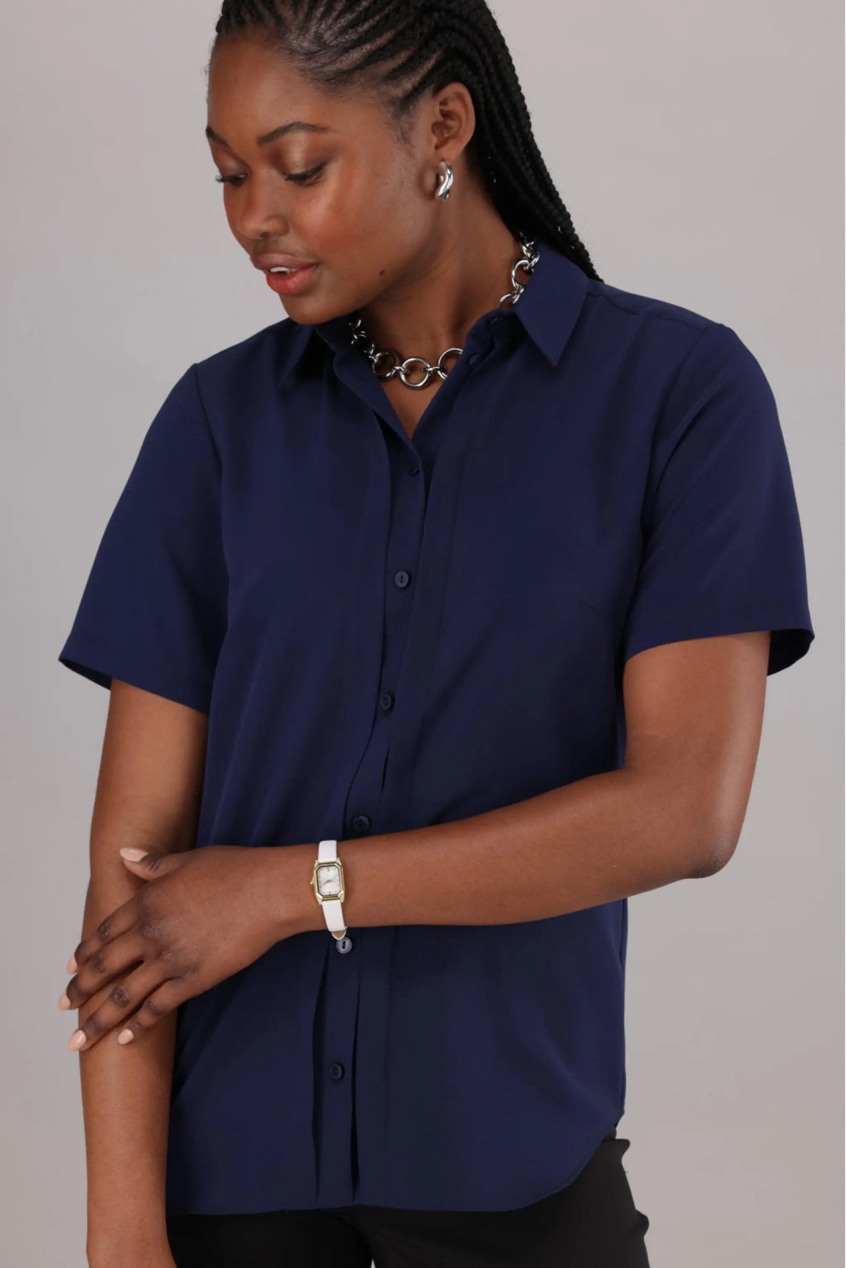 Navy Women’s Shirt Ideal for the Office from ImNow. It has Short Sleeves, Buttons and a Collar.