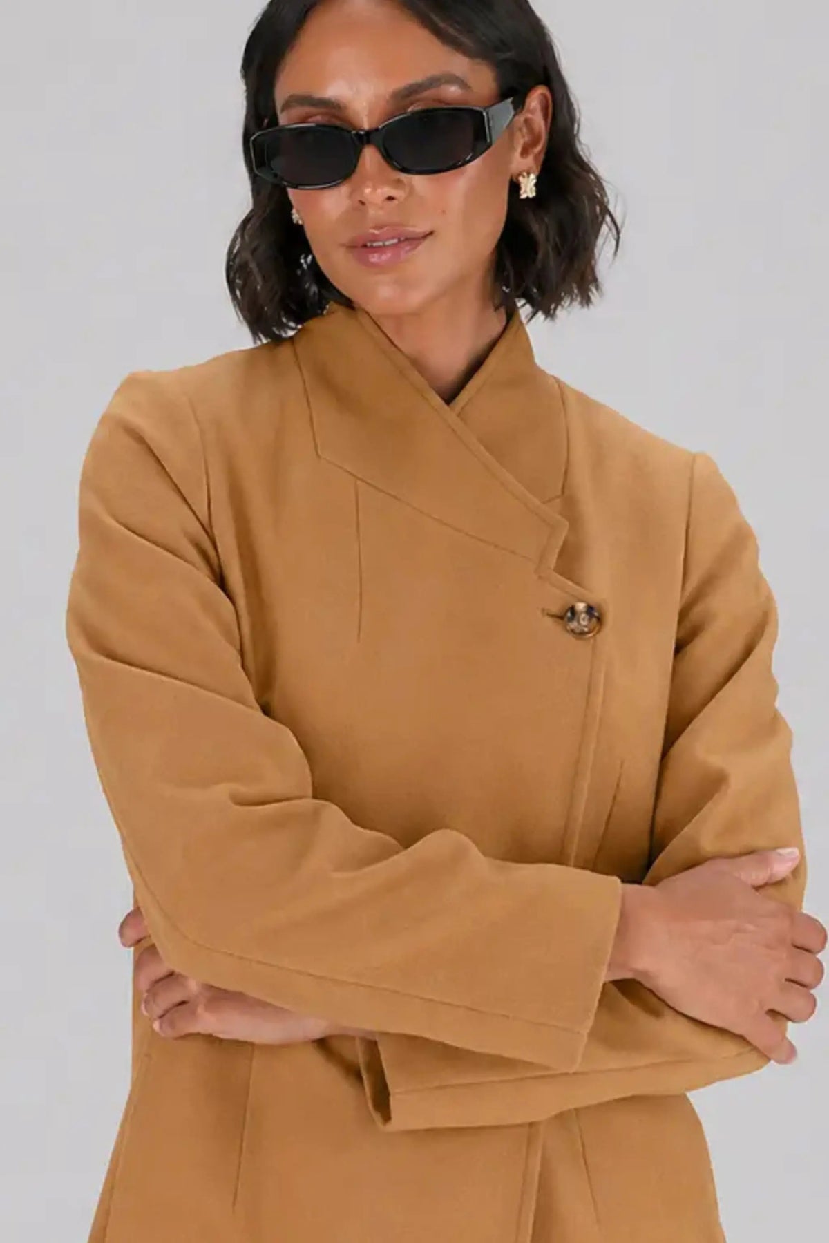 Ladies close up of our winter asymmetrical coat from ImNow.