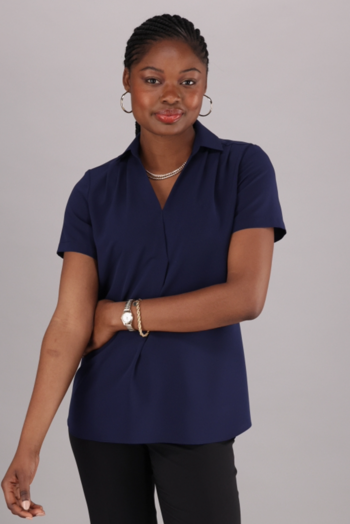 Navy Office-ready Women’s blouse with a V-neck, short sleeves and a soft relaxed fit by ImNow. 